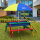 2in1 Kinder-Picknicktisch und Sand-Wasser-Spieltisch Nick Holz regenbogenbunt inkl. Sonnenschirm